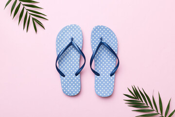 Flat lay composition with flip flops and seashell on colored background. Space for text top view