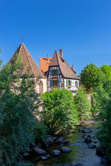 historic half-timbered houses on the Weiss River in the village center of Kaysersberg