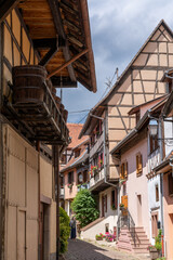 Fototapeta na wymiar narrow cobblestone street with colorful historic half-timbered houses