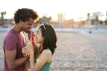 Beautiful young couple enjoy at the beach. Happy couple having fun at sea resort