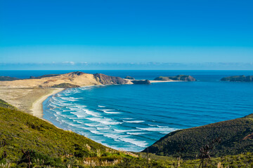 Stunning view over Te Werahi Beach and Cape Maria Van Diemen from a high vantage point in Cape Reinga on a bright winter day. North Island, New Zealand