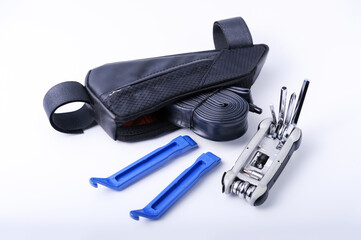 Bicycle emergency kit. Hand pump, inner tube, CO2 air pump, multi-function tool and tyre lever - obrazy, fototapety, plakaty