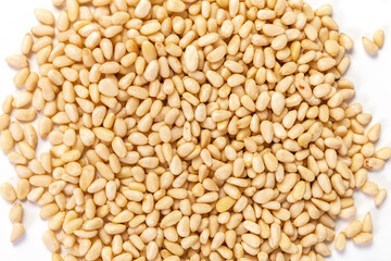 Pine nuts on a white background. Macro. Close up. Photo