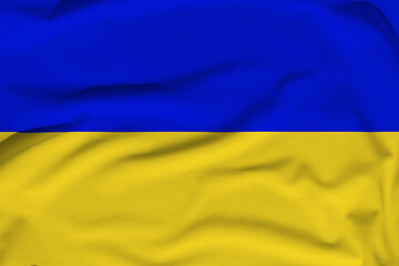 Ukrainian national flag, folds and hard shadows on the canvas