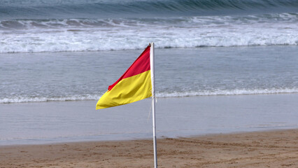 Beach Warning Flags to indicate the sea hazard on a sandy beach