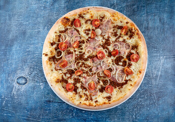 pizza with meat and cherry tomato
