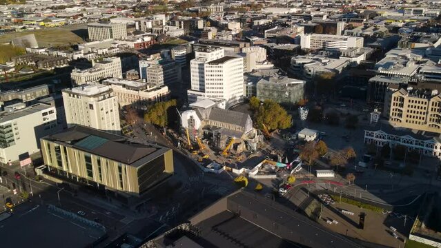 Construction of restoration of Christchurch Cathedral in city centre, demolished by earthquake. Aerial pull back