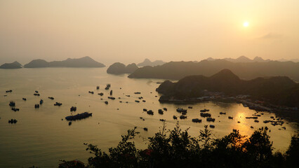 Sunset and night time light at Hạ Long Bay in northeast Vietnam.