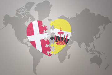 puzzle heart with the national flag of brunei and denmark on a world map background. Concept.