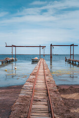 Wooden piers and boats for the oyster farm in Etang de Thau in South France
