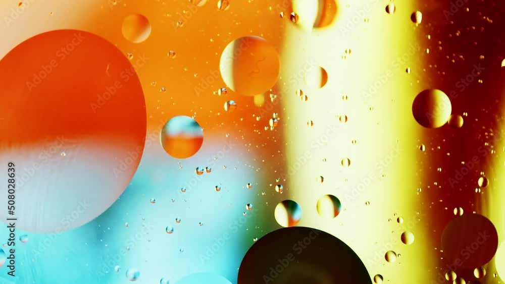 Poster real close up oil bubbles in water rotation with color gradient abstract mixing background.