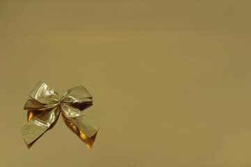 Golden bow on gold background