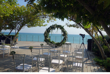Summer open air wedding ceremony with sea view.