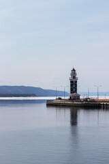 Lighthouse in the harbor of Lake Baikal near the village of Turka on a spring day
