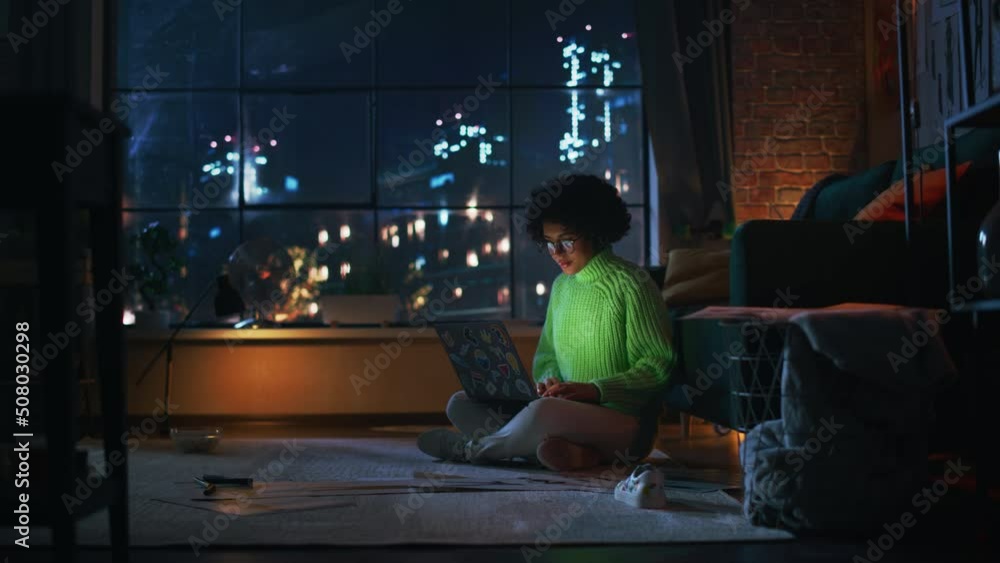 Leinwandbilder young hispanic it specialist working on laptop computer in creative evening environment. beautiful d