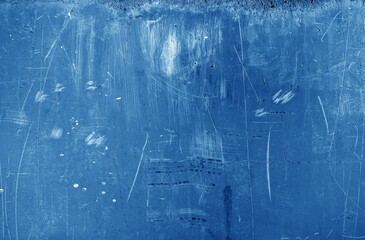Grungy rusted metal wall surface in navy blue tone.