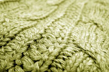 Warm knitting texture with blur effect in yellow tone.