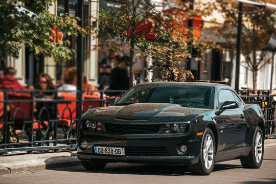 Odessa, Ukraine - September 5, 2021: Black american muscle car Chevrolet Camaro RS parked in the city
