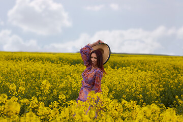 Fototapeta premium Girl in field.Enjoy and relax in nature.