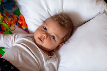 Children.Baby. Cute baby lies down and rests