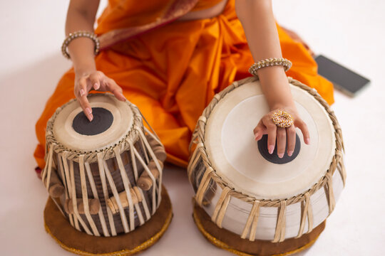 Close-up view of woman playing tabla