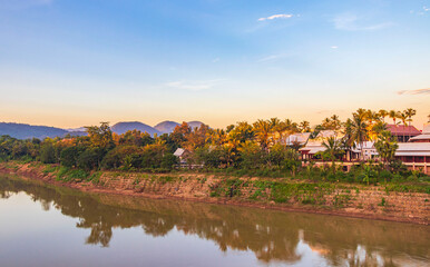 Fototapeta na wymiar Sunset at panorama landscape Mekong river and Luang Prabang Laos.