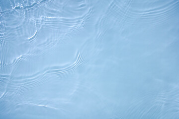 Transparent blue clear water surface texture with ripples, splashes and bubbles. Abstract nature...
