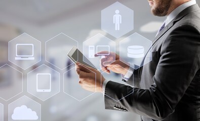 Businessman in suit using digital tablet. With development by implying new technologies  business...