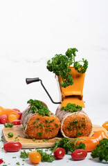 minced meat sausages in bacon with green parsley and fresh vegetables, cherry 