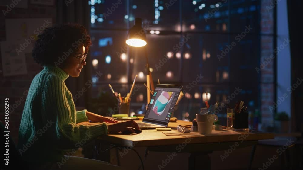 Leinwandbilder concentrated black female gamer using laptop computer while design video game with creative software