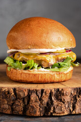 burger with meat, burger on a wooden table, juicy burger with different fillings