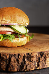 burger with meat, burger on a wooden table, juicy burger with different fillings