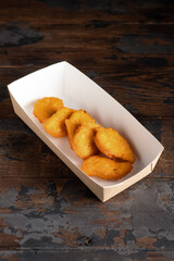 nuggets, crispy chicken nuggets on a wooden background