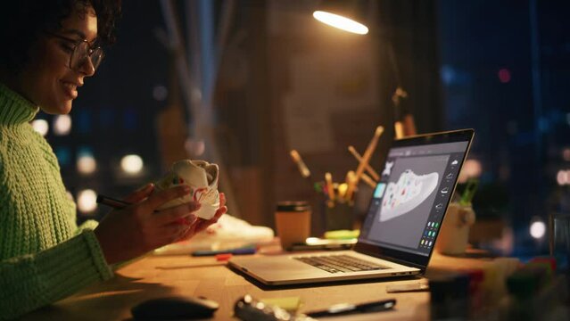 Dynamic Shot of Black Woman Sitting at Her Desk, Drawing, Working at Custom Made Sneakers. Female Professional Artist Applying her Own Design amd Make Unique Footwear. Moving Camera View