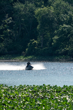 A man rides his jet-ski on the river in south New Jersey.