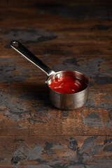 Cheese sauce, mustard, sour cream, tomato, sweet and sour sauce on a wooden background