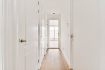 Narrow hallway at home with parquet floor