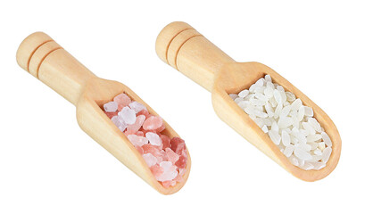 RicRice in a sсoop and Himalayan salt in a sсoop on an isolated white background.