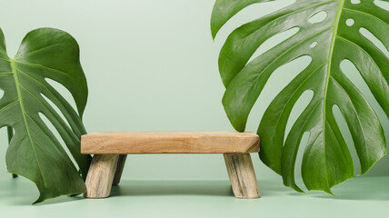 Blank wooden podium with monstera leaves, banner size