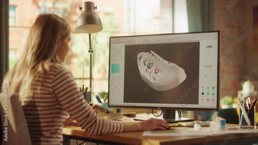 Fototapete young female designer rotate 3d model of shoe while working at new project on desktop computer at de