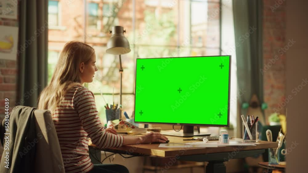 Poster Focused Female Designer Using Keyboard while Modelling on Desktop Computer with Green Chroma Key Monitor. Modern Freelancer at Remote Work Concept. Medium Shot