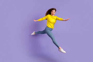 Fototapeta na wymiar Full length profile side photo of young woman have fun jump up fly isolated over purple color background