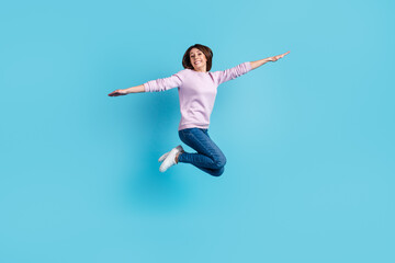 Full size profile side photo of young pretty woman have fun carefree hands wings fly isolated over blue color background