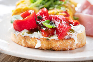 Tasty bruschetta with pepper and cream cheese