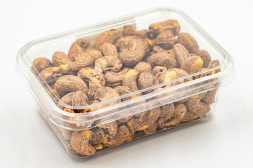 Shelled cashews. Packed cashews on white background. close up