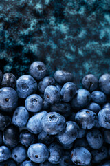 Closeup of fresh blueberry on a stone background