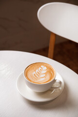 Coffee latte cup drink on a white table