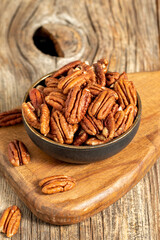 Pecan walnuts on wooden background. close up