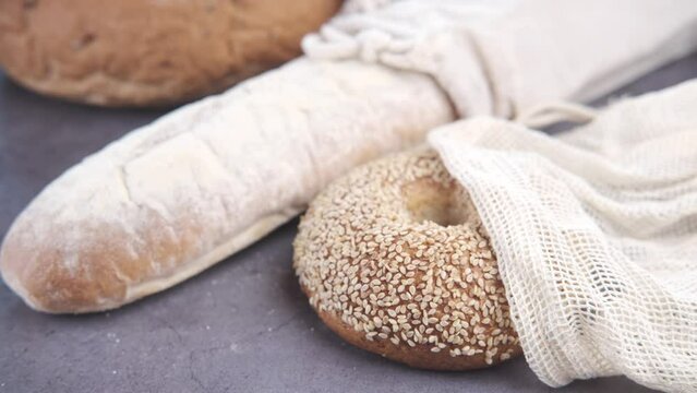 baked bread stored in a reusable linen bag . Eco friendly Zero waste concept..