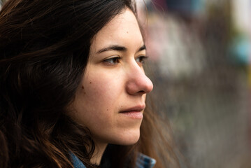 Expressive head shot of a 27 year old white girl with brown hair